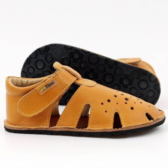 Tikki Aranya Mustard leather kids’ sandals. These barefoot sandals are breathable and feature velcro closures.
