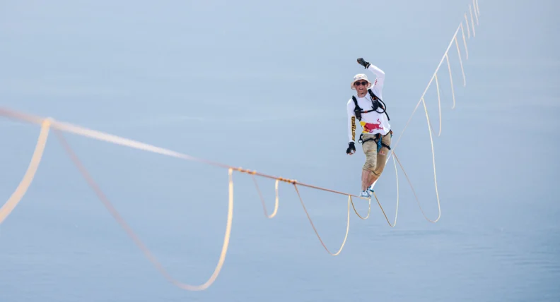 Red Bull Slackline athlete Jaan Roose on world's longest slackline (3.6km) between Italy and Sicily in barefoot shoes bought from Mugavik Barefoot. Photo from Red Bull Content Pool