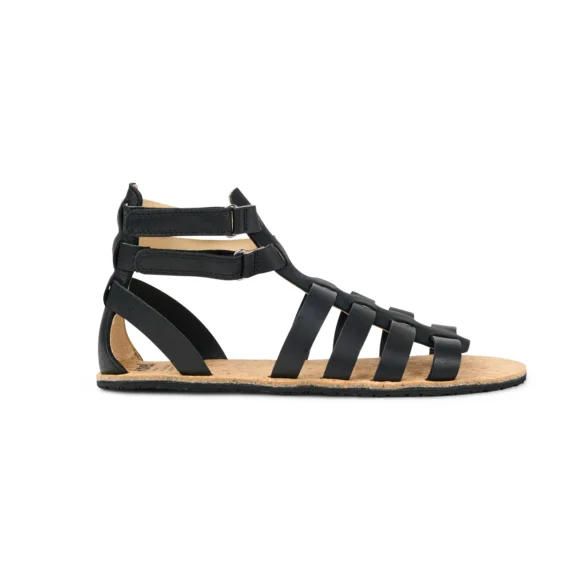 Koel Aurelia black leather barefoot sandals feature a natural cork sole and an ankle strap with a buckle closure.